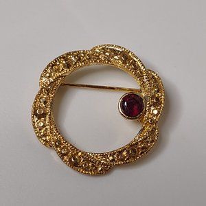 Round Gold Tone Brooch With Red Stone